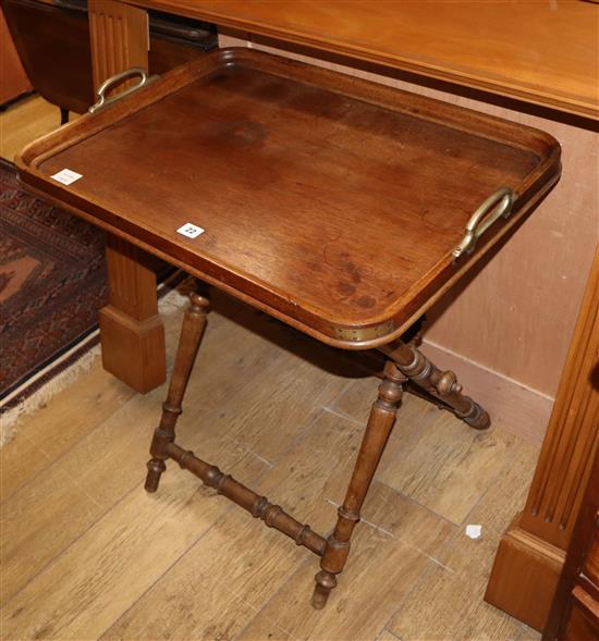 An oak butlers tray on folding stand, W.70cm D.50cm H.74cm
